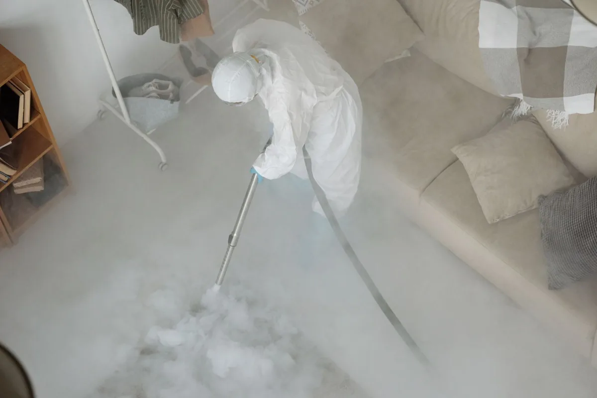 Biohazard cleanup technician in protective equipment, Lancaster, OH